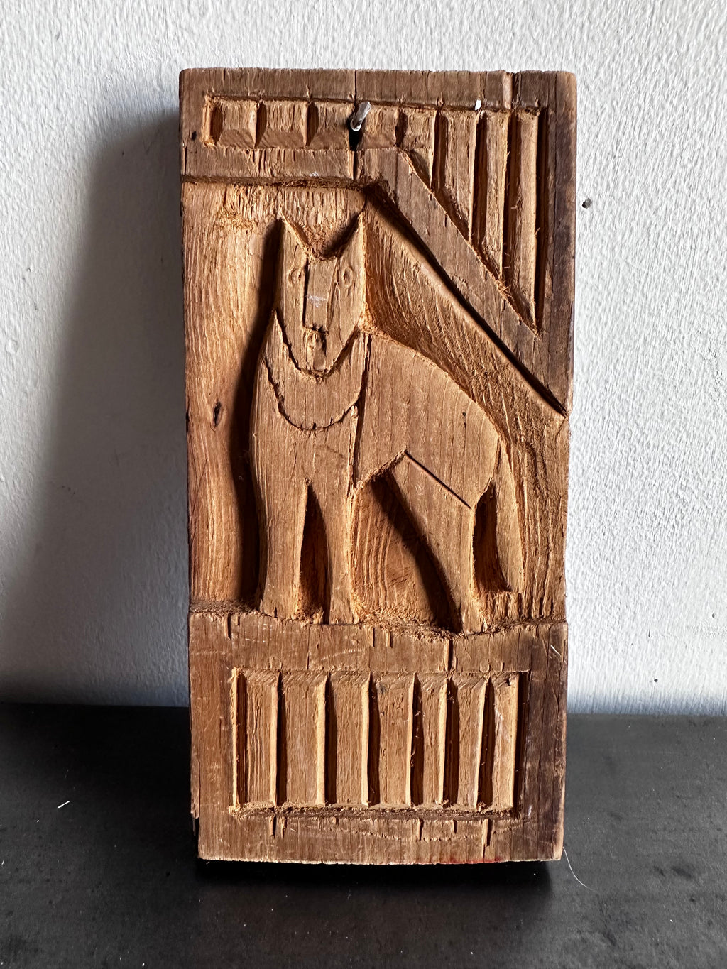 Carved wooden bird panel