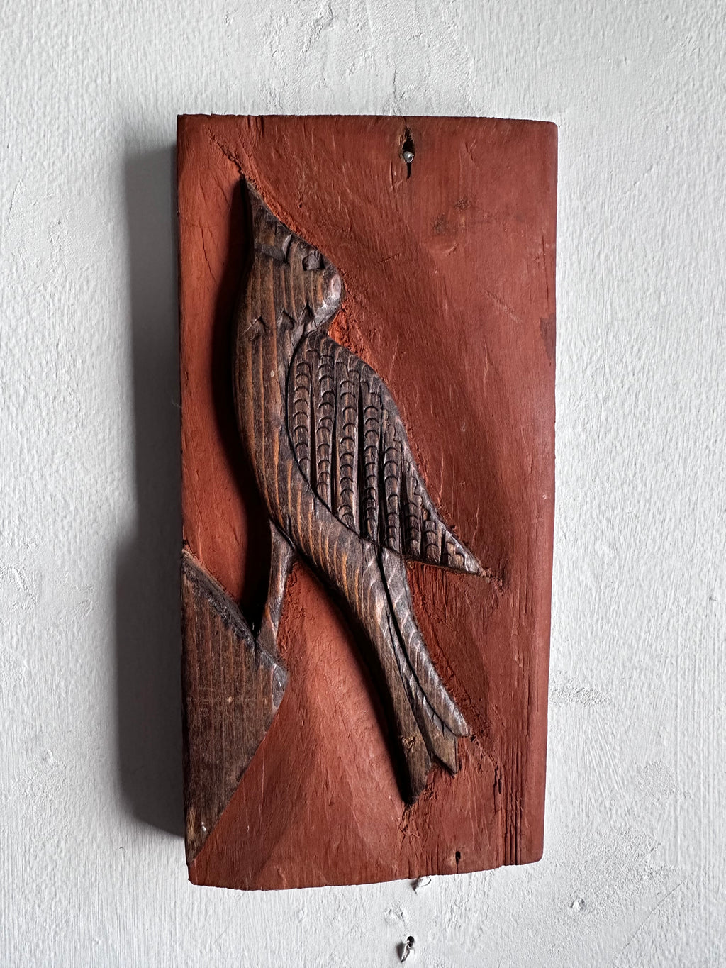Carved wooden bird panel