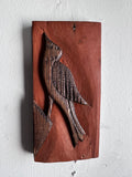 Carved wooden bird panel