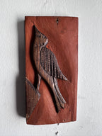 Carved wooden bird panel