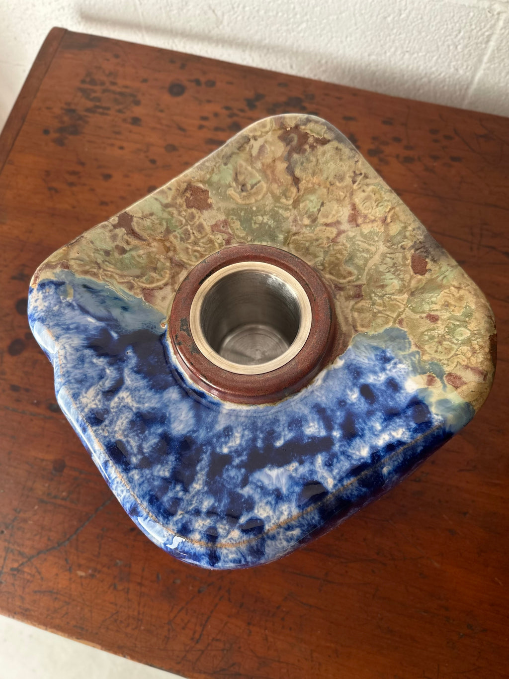 Blue and tan ceramic vessel