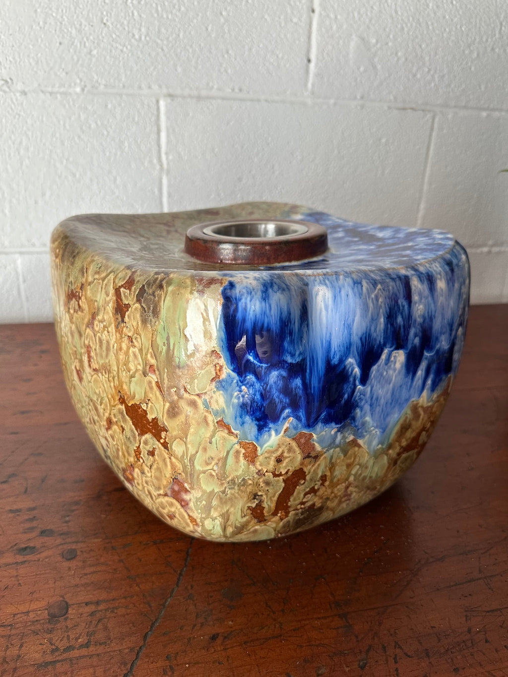 Blue and tan ceramic vessel