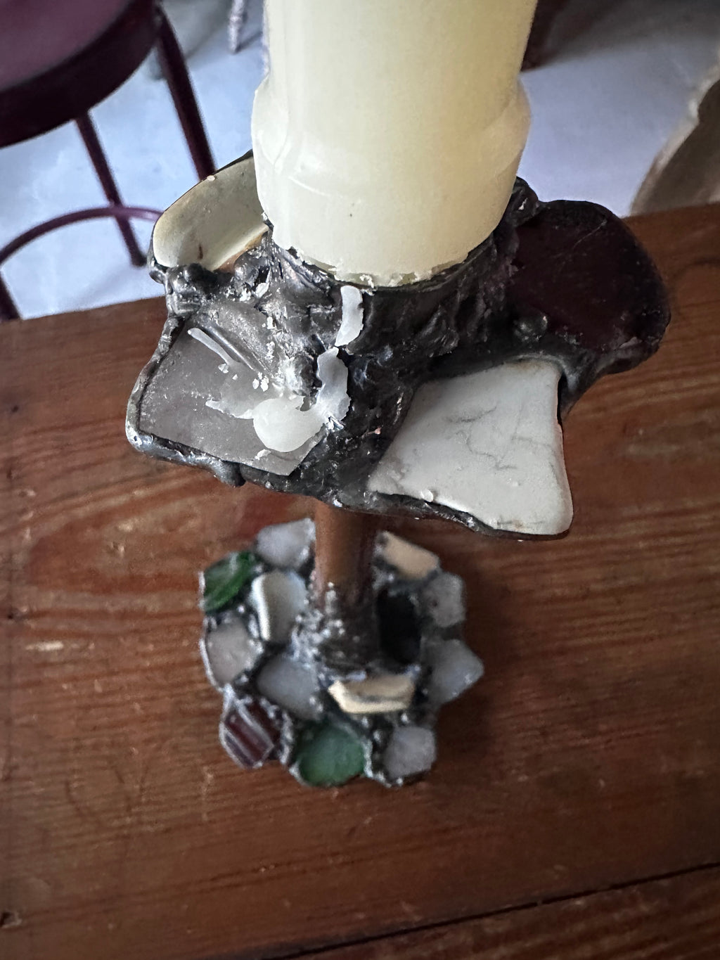 Stone encrusted candlestick