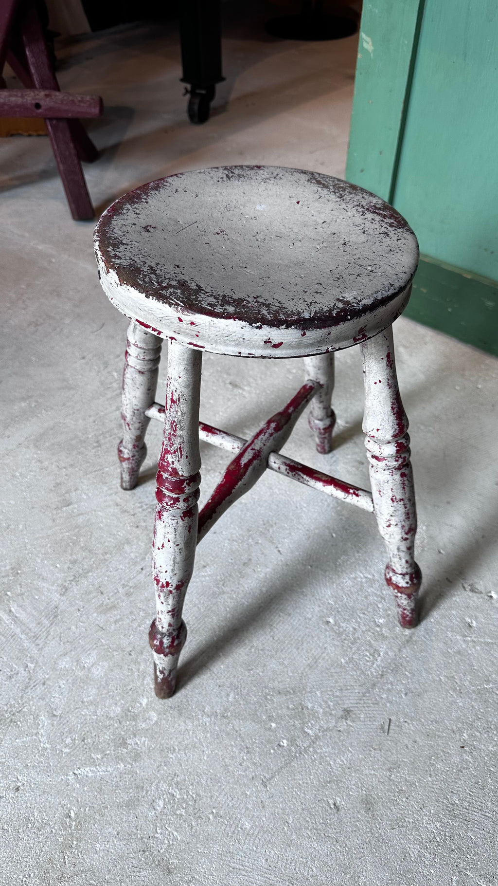 Gray and Red Milking Stool