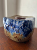 Blue and tan ceramic vessel
