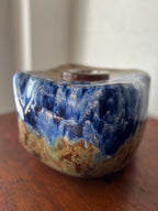 Blue and tan ceramic vessel