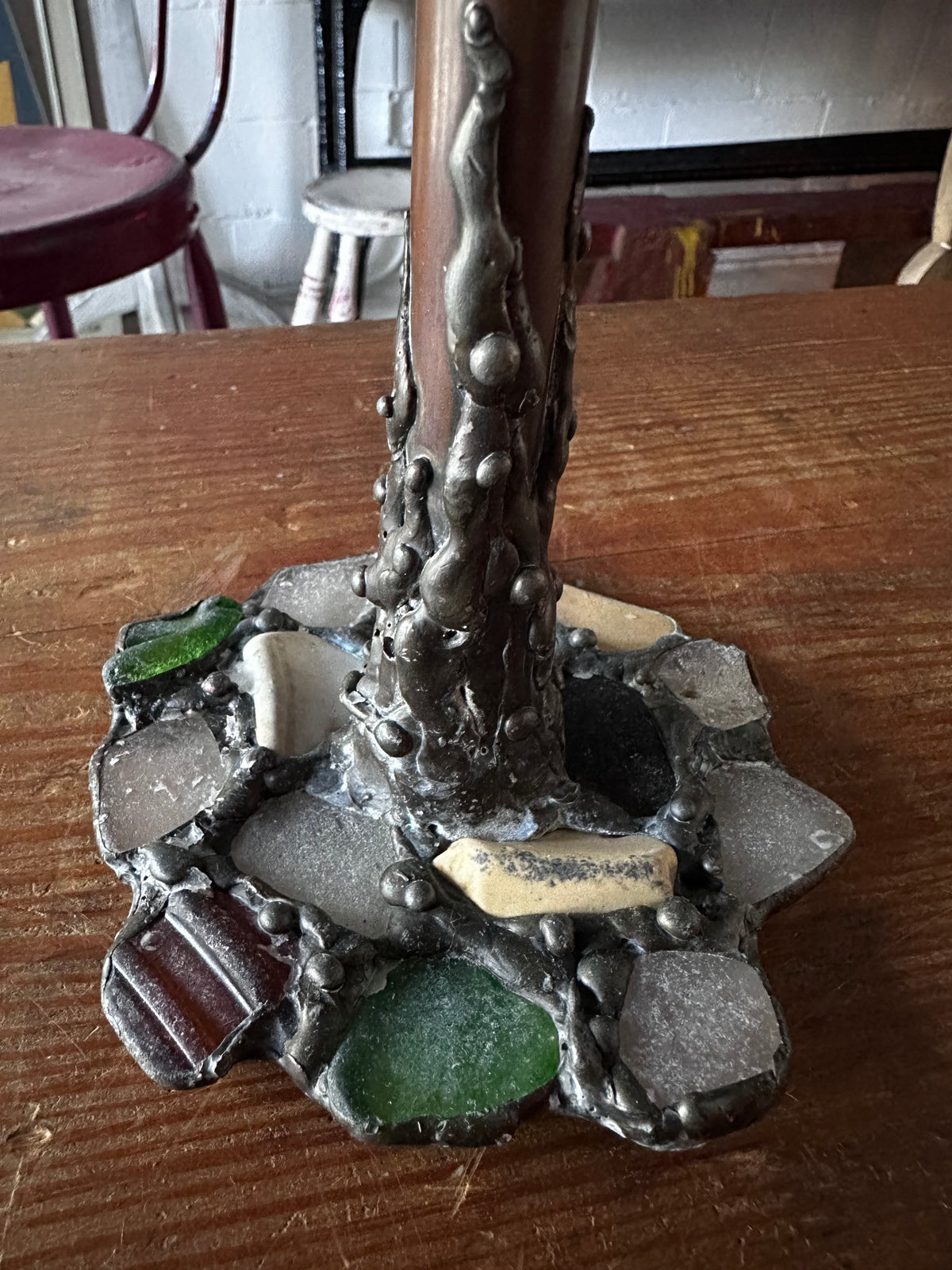 Stone encrusted candlestick