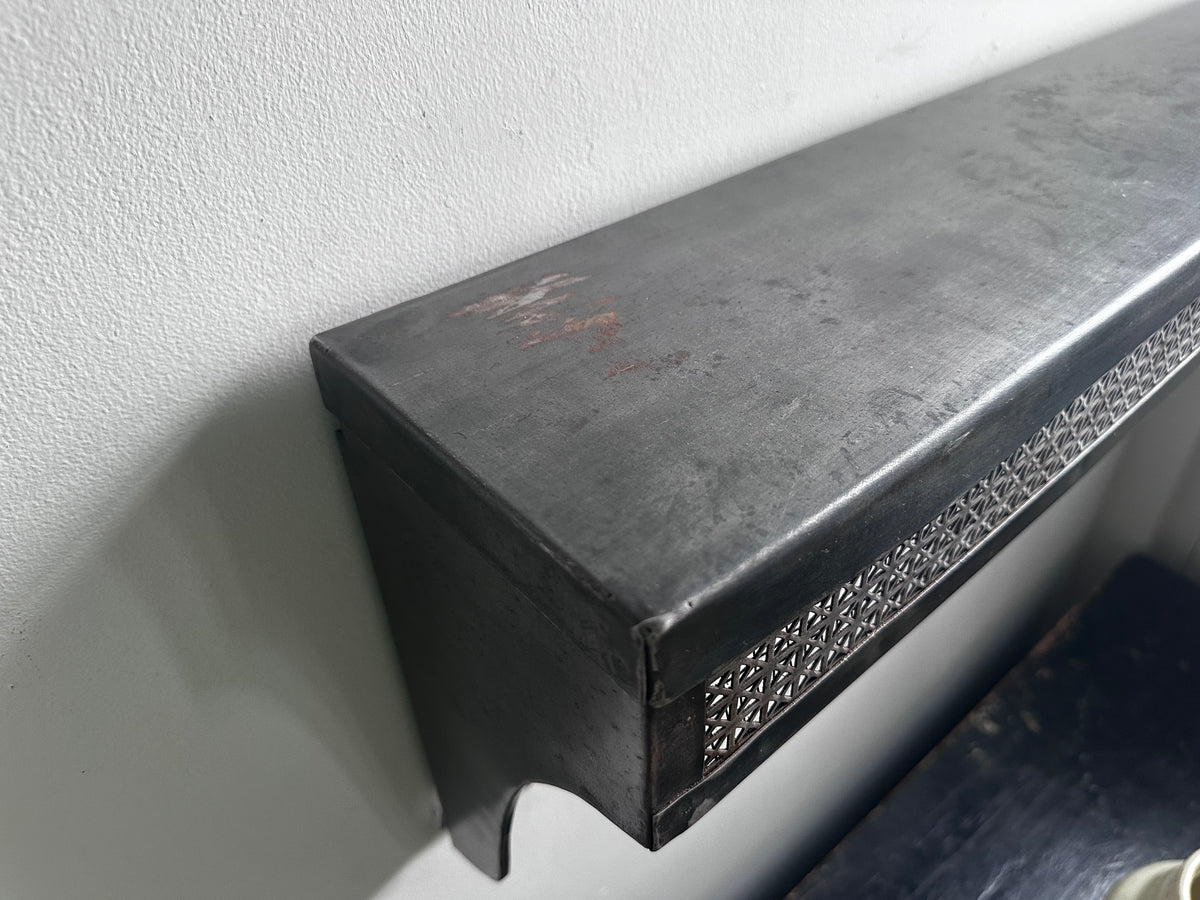 Stamped steel radiator shelf