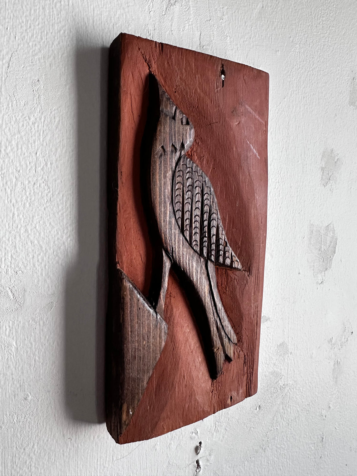 Carved wooden bird panel