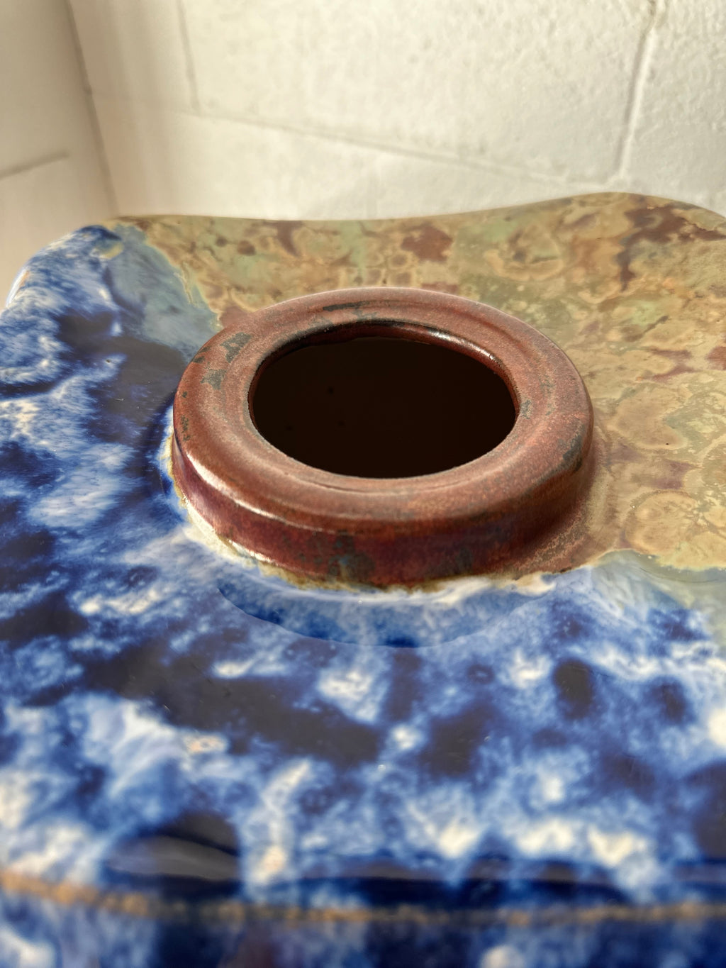 Blue and tan ceramic vessel