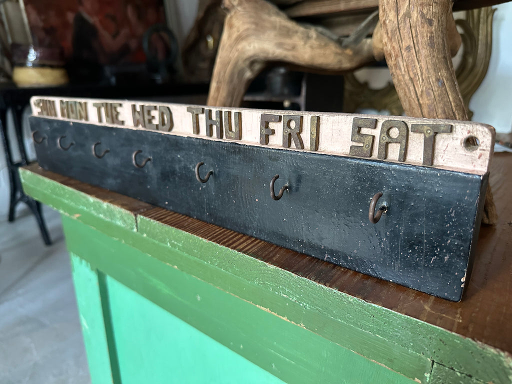 Early 20th century wooden weekly task board