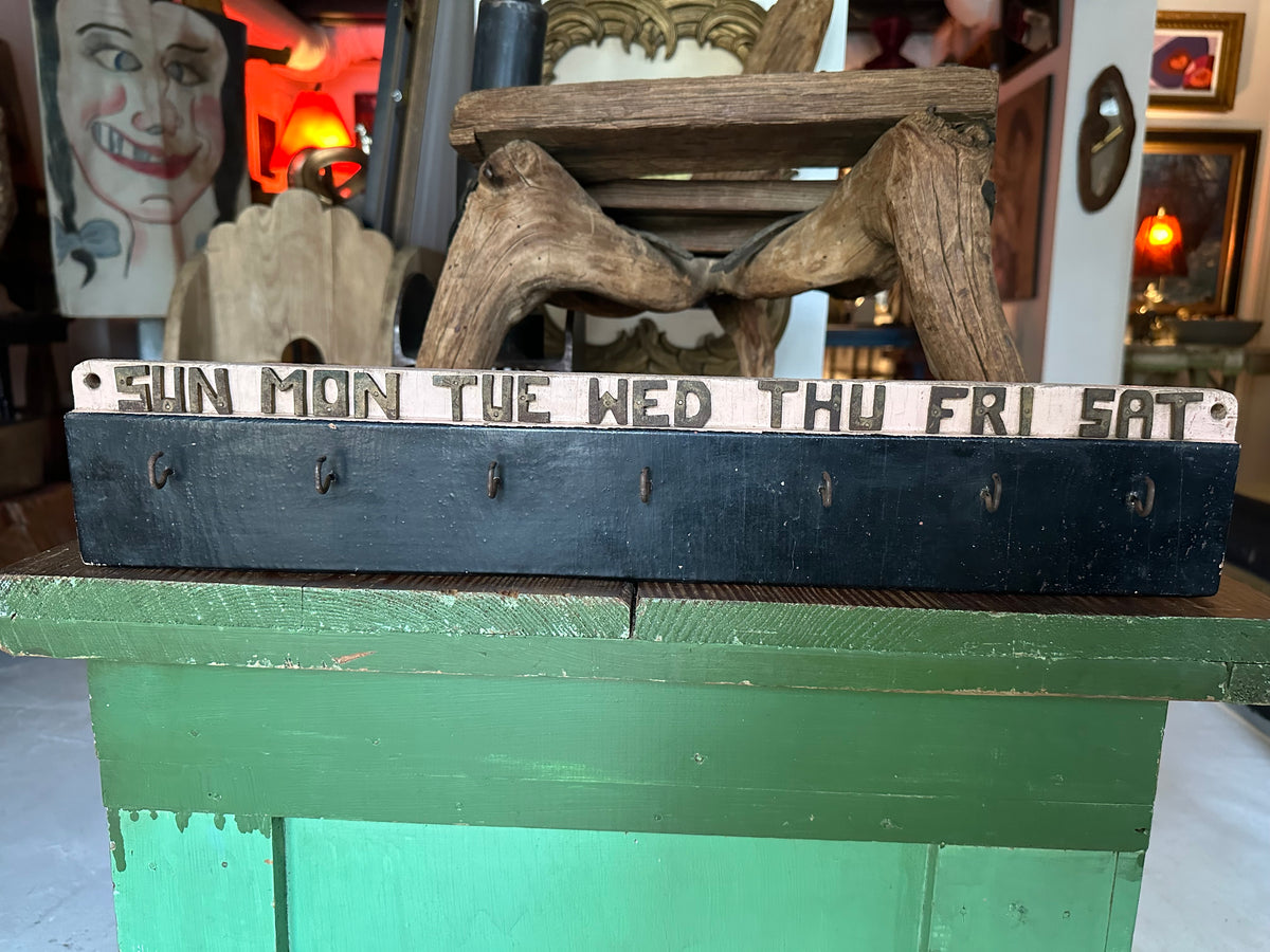 Early 20th century wooden weekly task board