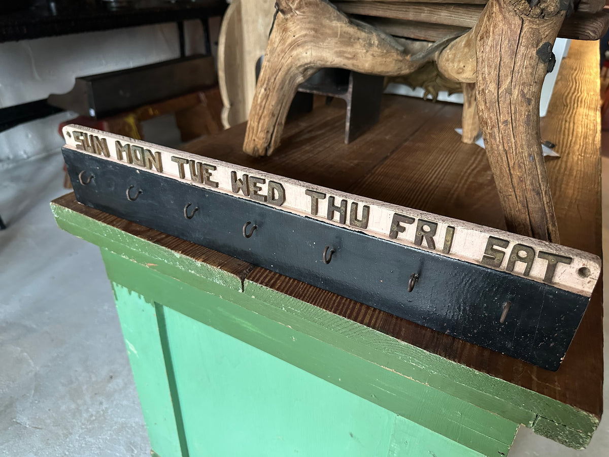Early 20th century wooden weekly task board